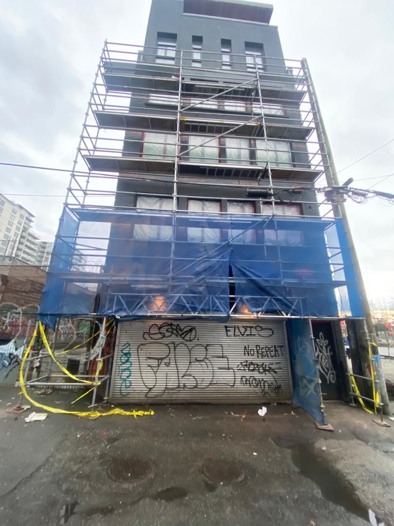 Scaffolded exterior of The Keefer building during restoration — Downtown Eastside