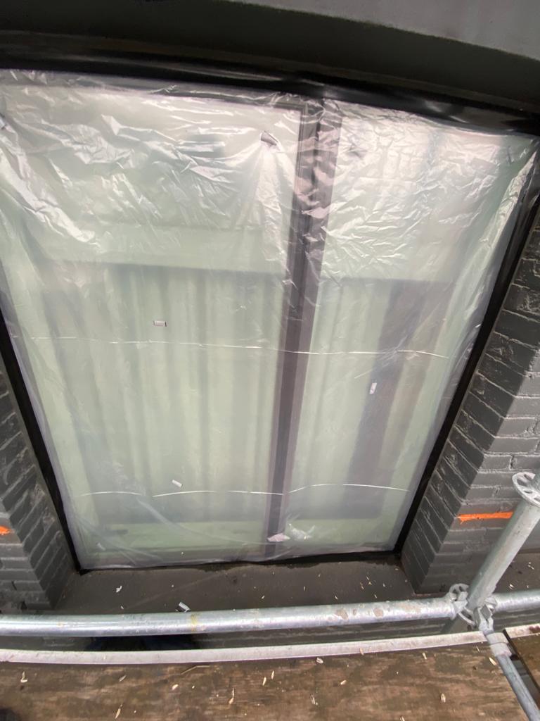 Window opening wrapped for weather protection — The Keefer