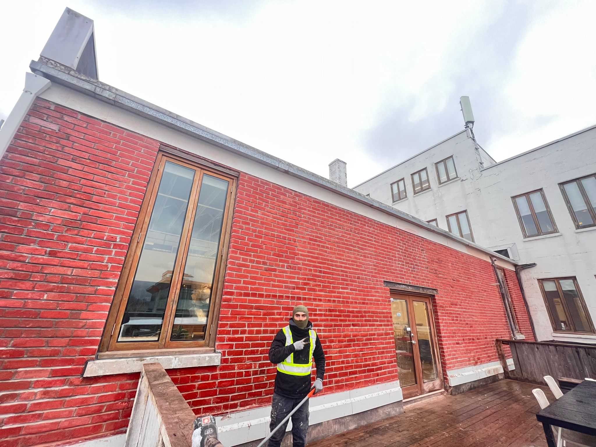 Rooftop addition with restored red brick — Living Spaces