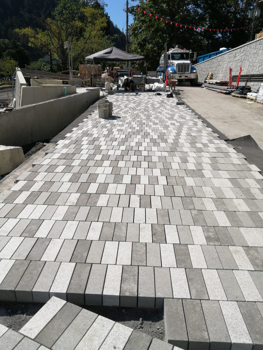 Paver run leading toward the feature wall — Sewell's Landing