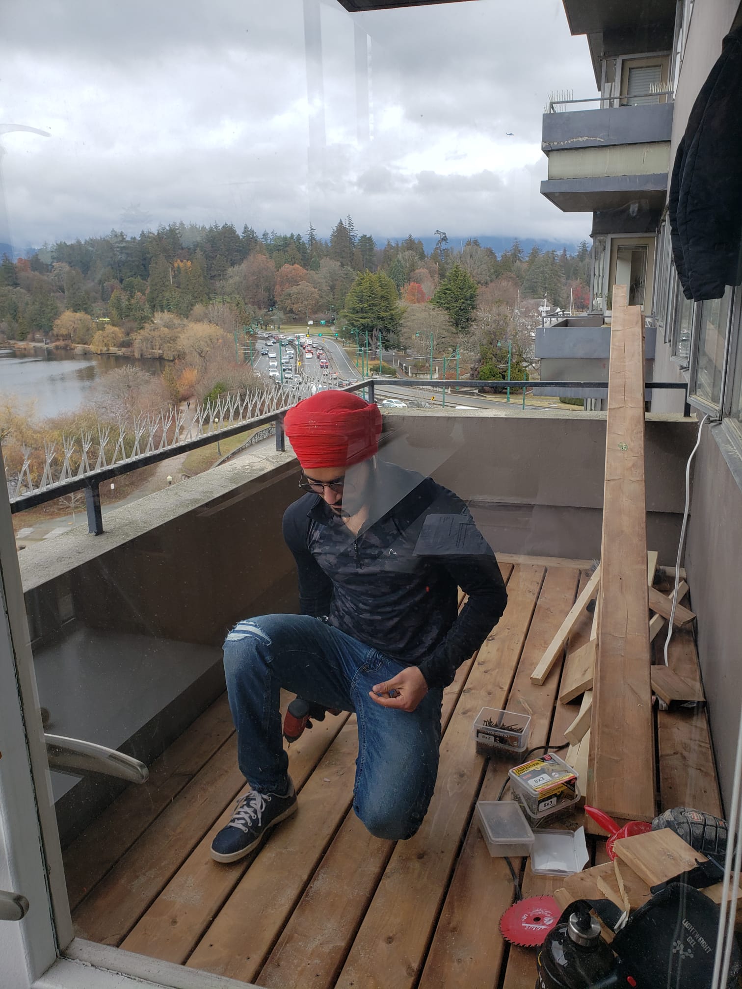 Crew working from an upper balcony during restoration — The Sun Tower